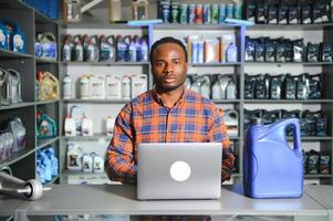 Smiling african Salesman Auto Parts Store photo