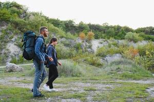 happy young couple hiking in mountain photo