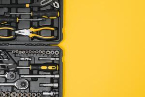 Set of various construction tools. Tools for home repair. Work at a construction site. On a yellow background. Flatly. Flatlay photo