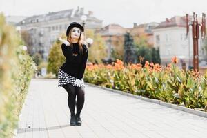 Portrait of a mime comedian. mime girl on the street photo