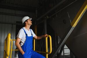 Portrait of factory worker. Young handsome factory worker. photo