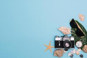 Preparation for Traveling concept, watch, airplane, money, passport, pencils, book, Photo frame, eyeglass on blue background with copy space.