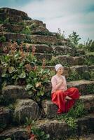 In nature, a woman meditates and does breathing practices photo