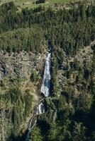 Hiking in the Austrian Alps. Hiking in the mountains. Serpentine road in the mountains photo