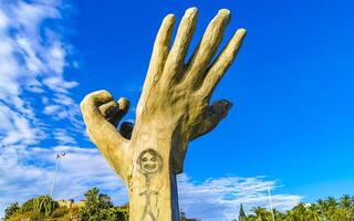 Puerto Escondido Oaxaca Mexico 2022 Hands stone rock statue sculpture beach Puerto Escondido Mexico. photo