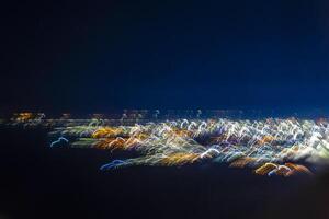 Flight take off landing airplane over city night abstract blurred. photo