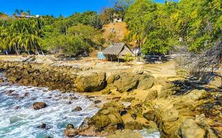 Beautiful rocks cliffs view waves at beach coast panorama Mexico. photo