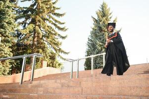 education, graduation and people concept - happy Indian Male graduate student. photo