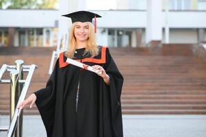 Educational theme graduating student girl in an academic gown. photo