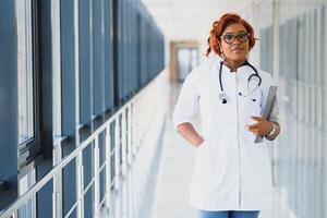 portrait of pretty african medical doctor. african american doctor in modern clinic photo