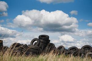 Heap of old Tires in recycling plant in Thailand photo