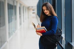 Smiling female student enhancing her future by attending regular lectures photo