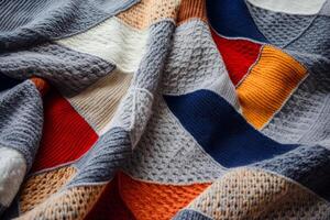 AI generated A cozy knitted blanket in a patchwork pattern. Generative AI photo