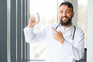 Doctor's hand offering pills. Healthcare concept. photo