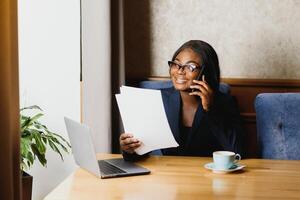 Young black businesswoman talking on the phone. photo