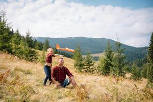 Happy father and little child are walking in the mountains. Father's Day. vacation in the national park. photo