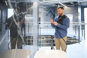 Young man choosing a bath and bath sink photo