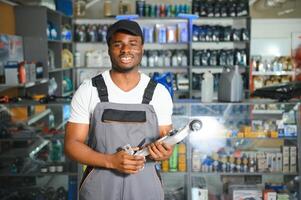 Smiling african Salesman Auto Parts Store photo