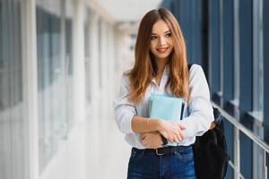 Smiling female student enhancing her future by attending regular lectures photo