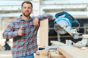 carpenter man furniture artisan handcrafted making woodwork at wood workshop photo