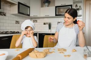 Happy family. Mother teaching her son how to cooking cake menu in morning. healthy lifestyle concept.. Baking Christmas cake and cook concept photo