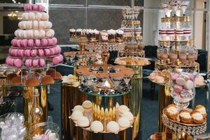 Delicious wedding reception candy bar dessert table. macaroon on candy bar, candy bar on holiday, candy bar at the wedding. photo