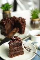 Chocolate Fudge Cake with fork and knife served in plate on food table top view cafe bake dessert photo