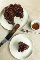Chocolate Fudge Cake with fork and knife served in plate on food table top view cafe bake dessert photo
