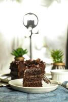 Chocolate Fudge Cake with fork and knife served in plate on food table top view cafe bake dessert photo