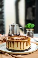 Salted Caramel Blondie cake include chocolate cream, sugar with fork, cup of coffee and pot served on board isolated on napkin side view of cafe food photo