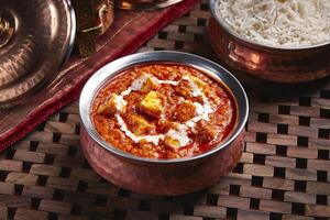 Butter daal makhani with white rice served in dish isolated on table side view of middle east food photo