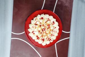 Premium Red Velvet cake include cream, sugar served on board isolated on napkin top view of cafe food photo