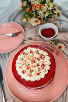 Premium Red Velvet cake include cream, sugar served on board isolated on napkin side view of cafe food photo