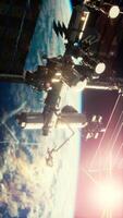 International Space Station ISS floating in orbit above planet earth, vertical video