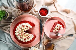 Premium Red Velvet cake and slice include cream, sugar with fork, cup of coffee and pot served on board isolated on napkin top view of cafe food photo