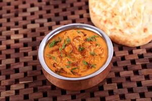 Mughlai Chicken Lamb Curry with bread served in dish isolated on table side view of middle east food photo