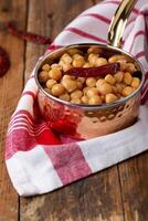 Chickpeas, channay and chana masala served in dish isolated on table side view of arabian food photo