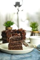 Chocolate Fudge Cake with fork and knife served in plate on food table top view cafe bake dessert photo