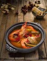 Live Prawn with Herbal Soup and Chinese Wine served in dish isolated on table top view of food photo