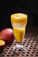 Sparkling Mango soda cocktail served in glass isolated on table side view of middle east food photo