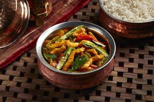 Chicken Chili with white rice served in dish isolated on table side view of middle east food photo