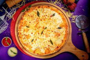 queen margherita pizza with tomato sauce and mayo isolated on wooden board top view of italian food on wooden background photo