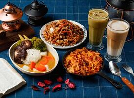 Assorted Aw Vegetable Curry, Grilled Spicy Chow Mein, Fried Instant Noodles with Fried Sauce, latte, Matcha Coffee Latte served in dish isolated on table top view of taiwan food photo