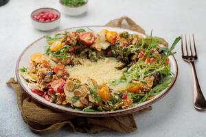 Chicken Couscous Salad rice with pomegranate seeds served in dish isolated on table top view of arabian food photo