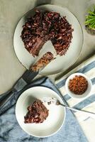 Chocolate Fudge Cake with fork and knife served in plate on food table top view cafe bake dessert photo