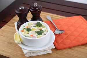 Cream Vegetable With Chicken Soup served in a bowl isolated on table side view of middle east food photo