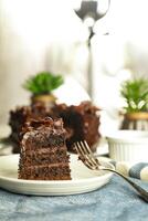 Chocolate Fudge Cake with fork and knife served in plate on food table top view cafe bake dessert photo
