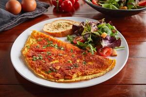 egg and cream omelette roll with salad served in a dish isolated on wooden background side view photo