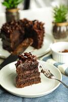 Chocolate Fudge Cake with fork and knife served in plate on food table top view cafe bake dessert photo