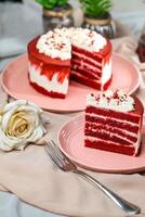 Premium Red Velvet cake and slice include cream, sugar with fork, cup of coffee and pot served on board isolated on napkin side view of cafe food photo